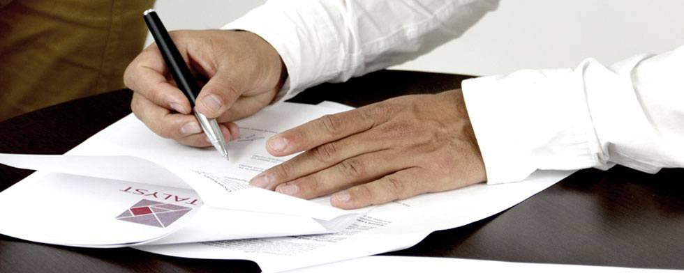 person signing a document